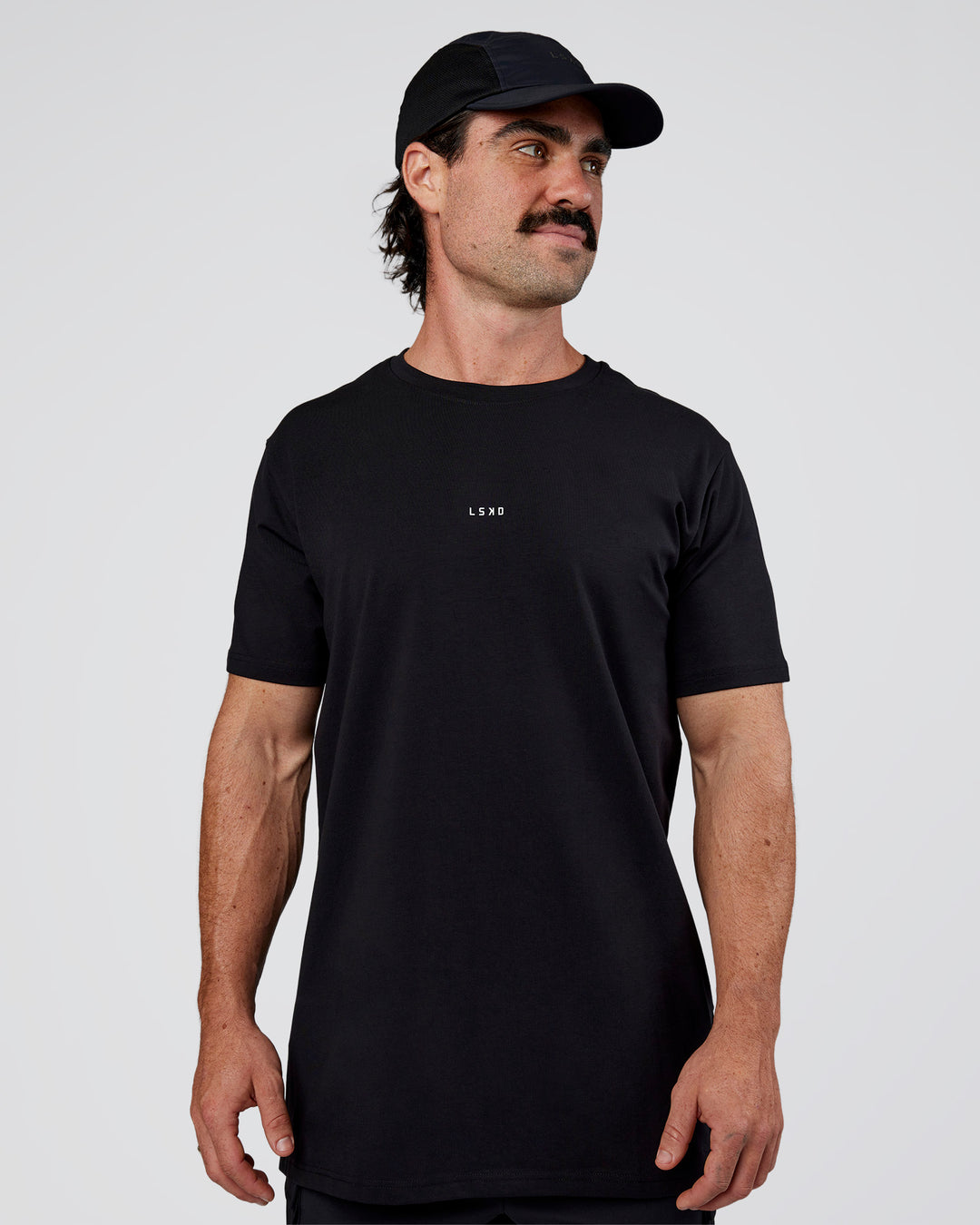 Man wearing Base FLXCotton Tee  Regular Fit +2cm - Black | Model:Adam | Size:L