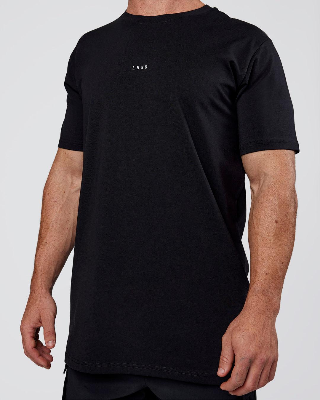 Man wearing Base FLXCotton Tee  Regular Fit +2cm - Black | Model:Adam | Size:L
