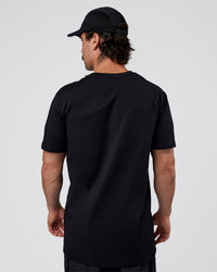 Man wearing Base FLXCotton Tee  Regular Fit +2cm - Black | Model:Adam | Size:L
