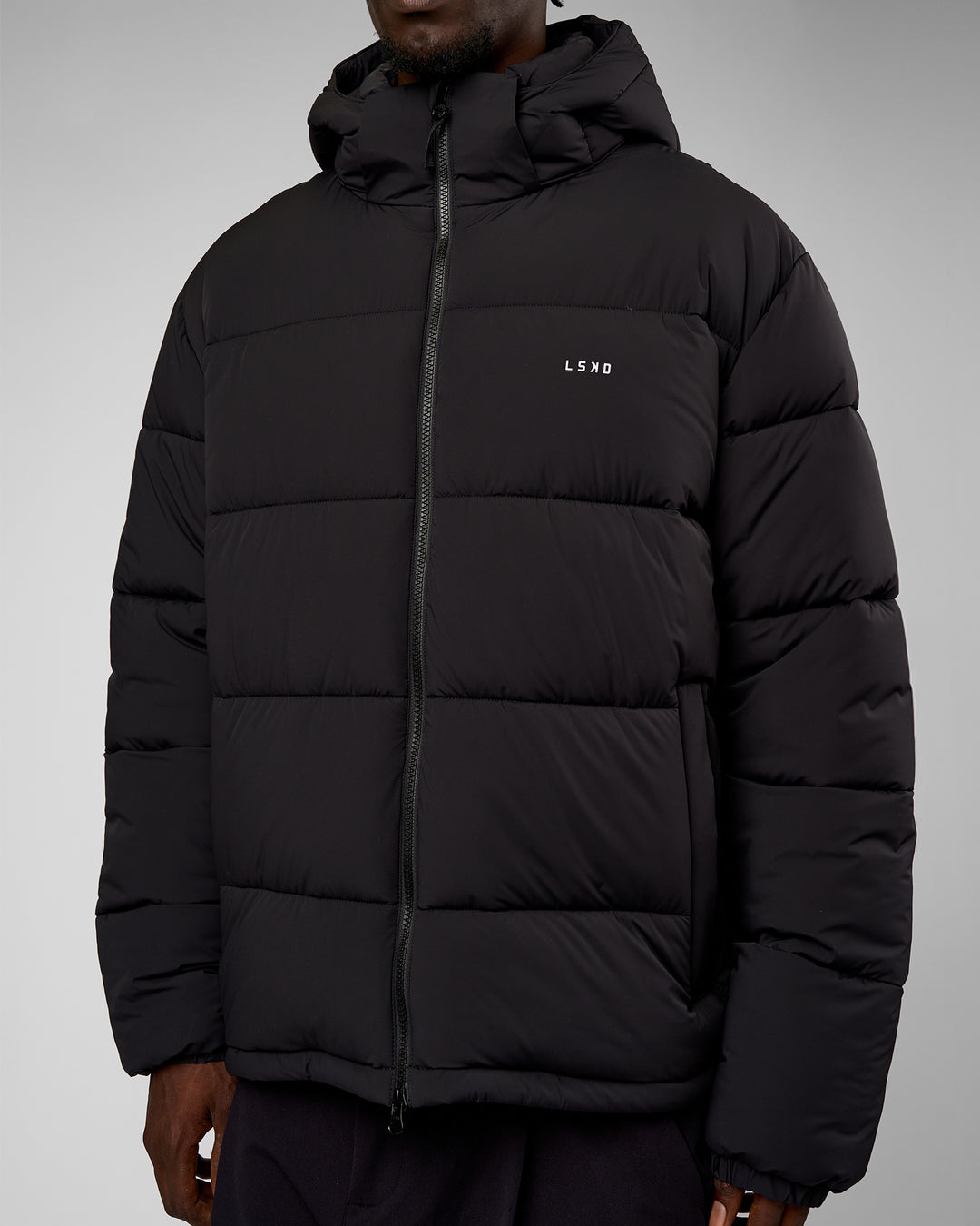 Man wearing Base Puffer Jacket - Black | Model:Okello | Size:L