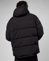 Man wearing Base Puffer Jacket - Black | Model:Okello | Size:L