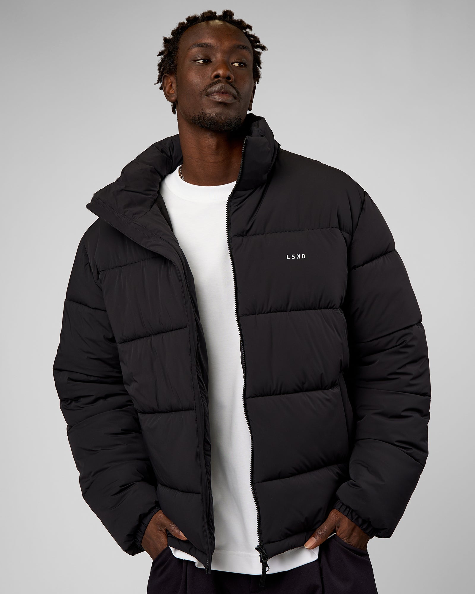 Man wearing Base Puffer Jacket - Black | Model:Okello | Size:L