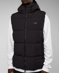 Man wearing Base Puffer Vest - Black | Model:Okello | Size:L