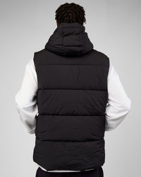 Man wearing Base Puffer Vest - Black | Model:Okello | Size:L