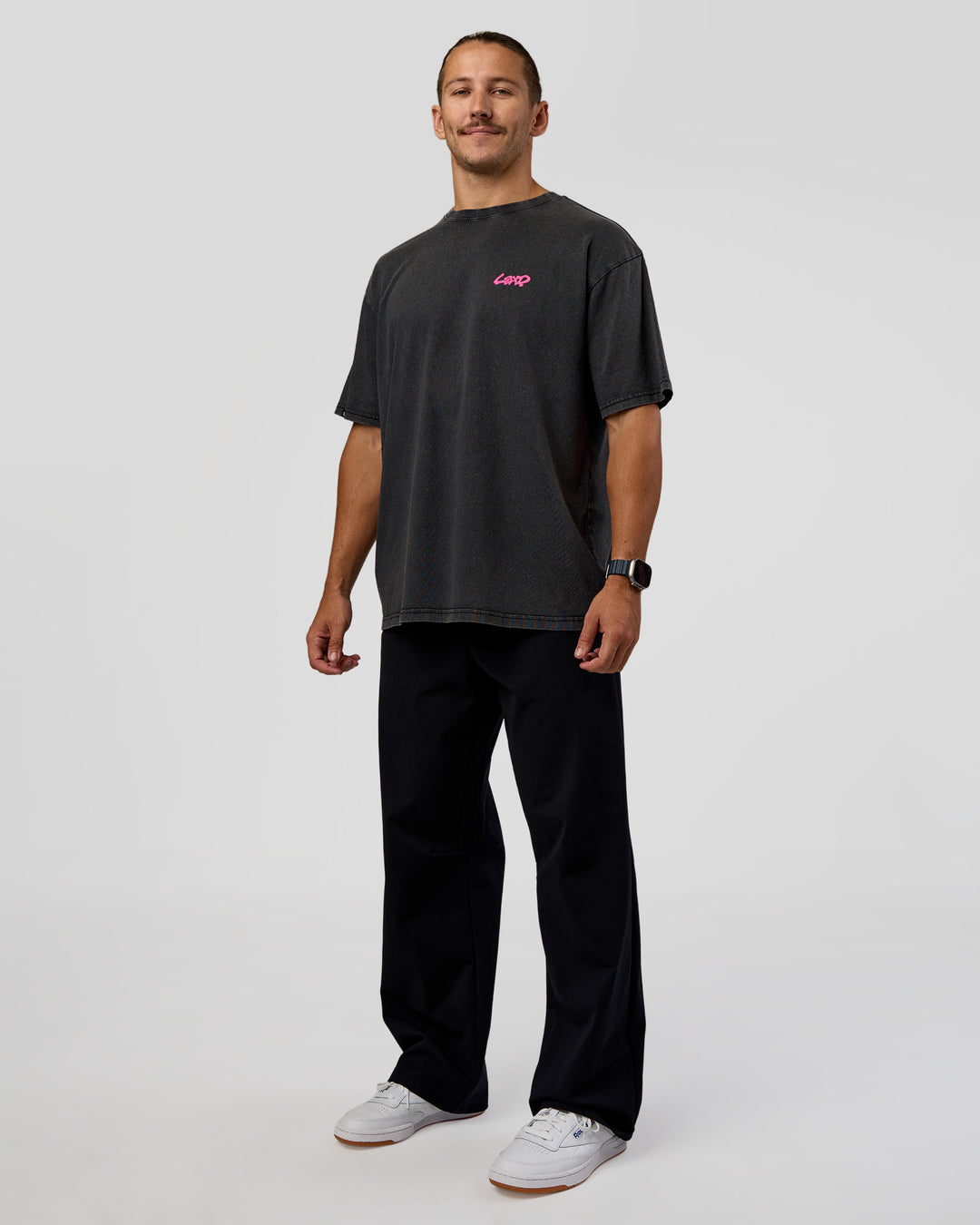 Man wearing Break Through FLXCotton Oversized Tee - Black-Plum Caspia | Model:Jaiden | Size:L