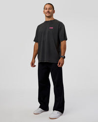 Man wearing Break Through FLXCotton Oversized Tee - Black-Plum Caspia | Model:Jaiden | Size:L