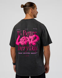 Man wearing Break Through FLXCotton Oversized Tee - Black-Plum Caspia | Model:Jaiden | Size:L