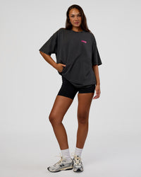 Woman wearing Break Through FLXCotton Oversized Tee - Black-Plum Caspia | Model:Kirstyn | Size:L