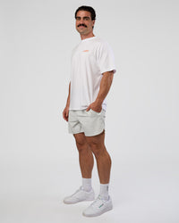 Man wearing Break Through FLXCotton Oversized Tee - White-Pale Lilac | Model:Adam | Size:L