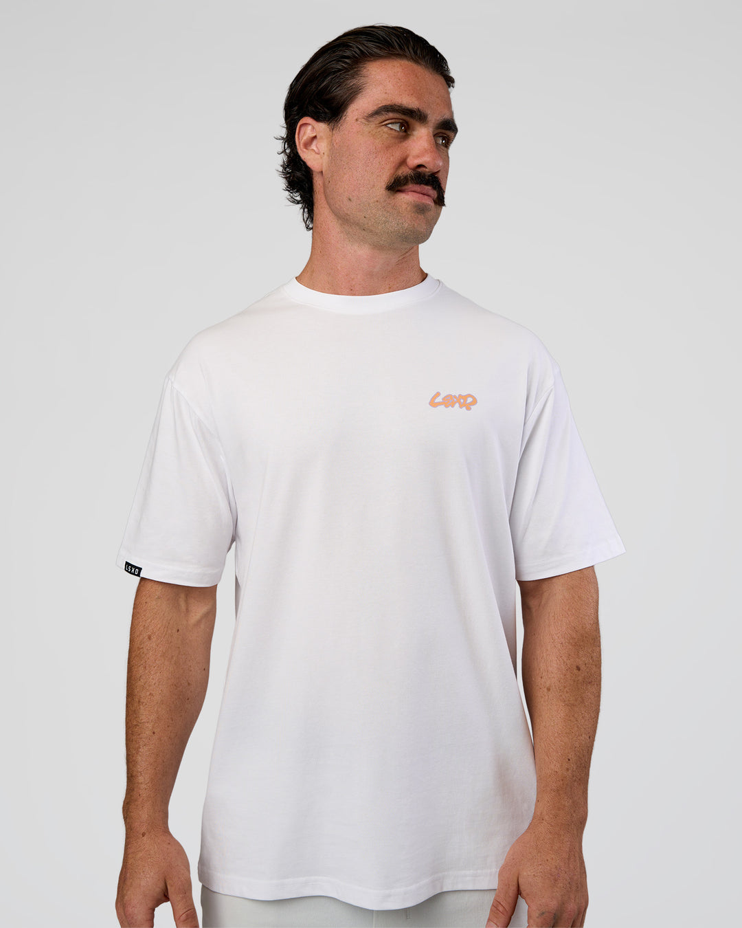 Man wearing Break Through FLXCotton Oversized Tee - White-Pale Lilac | Model:Adam | Size:L