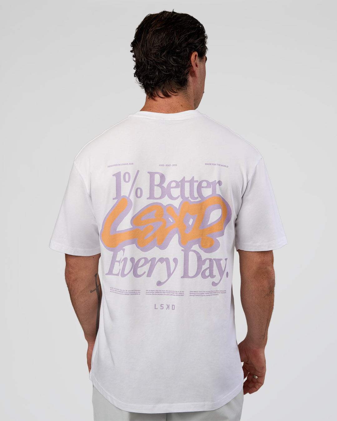 Man wearing Break Through FLXCotton Oversized Tee - White-Pale Lilac | Model:Adam | Size:L