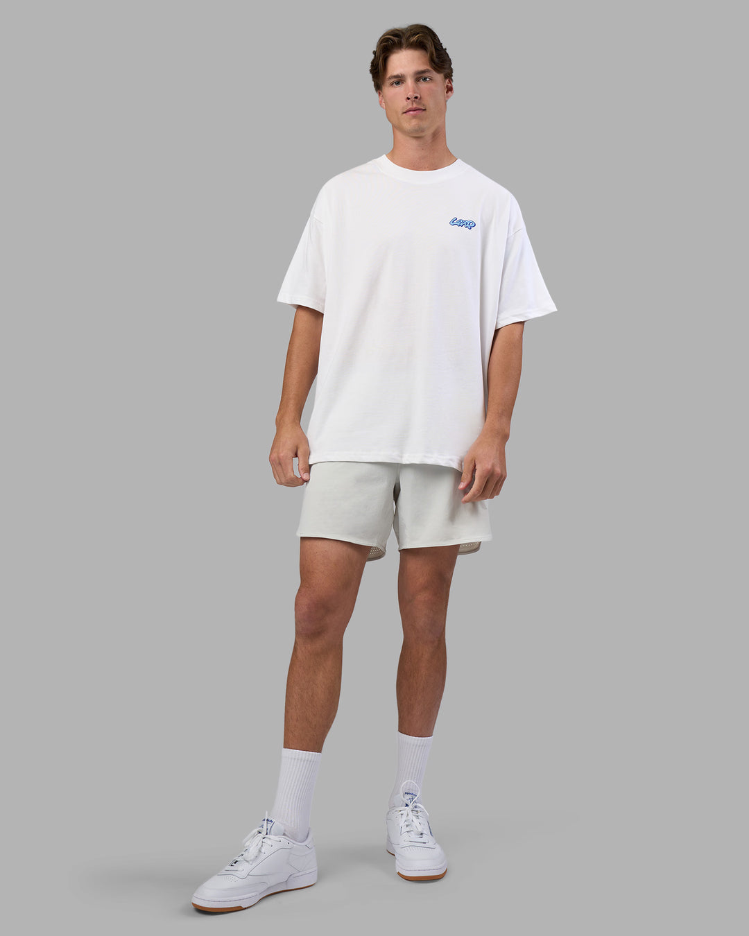 Man wearing Break Through Heavyweight Oversized Tee - White-Power Cobalt | Model:Brandon | Size:L