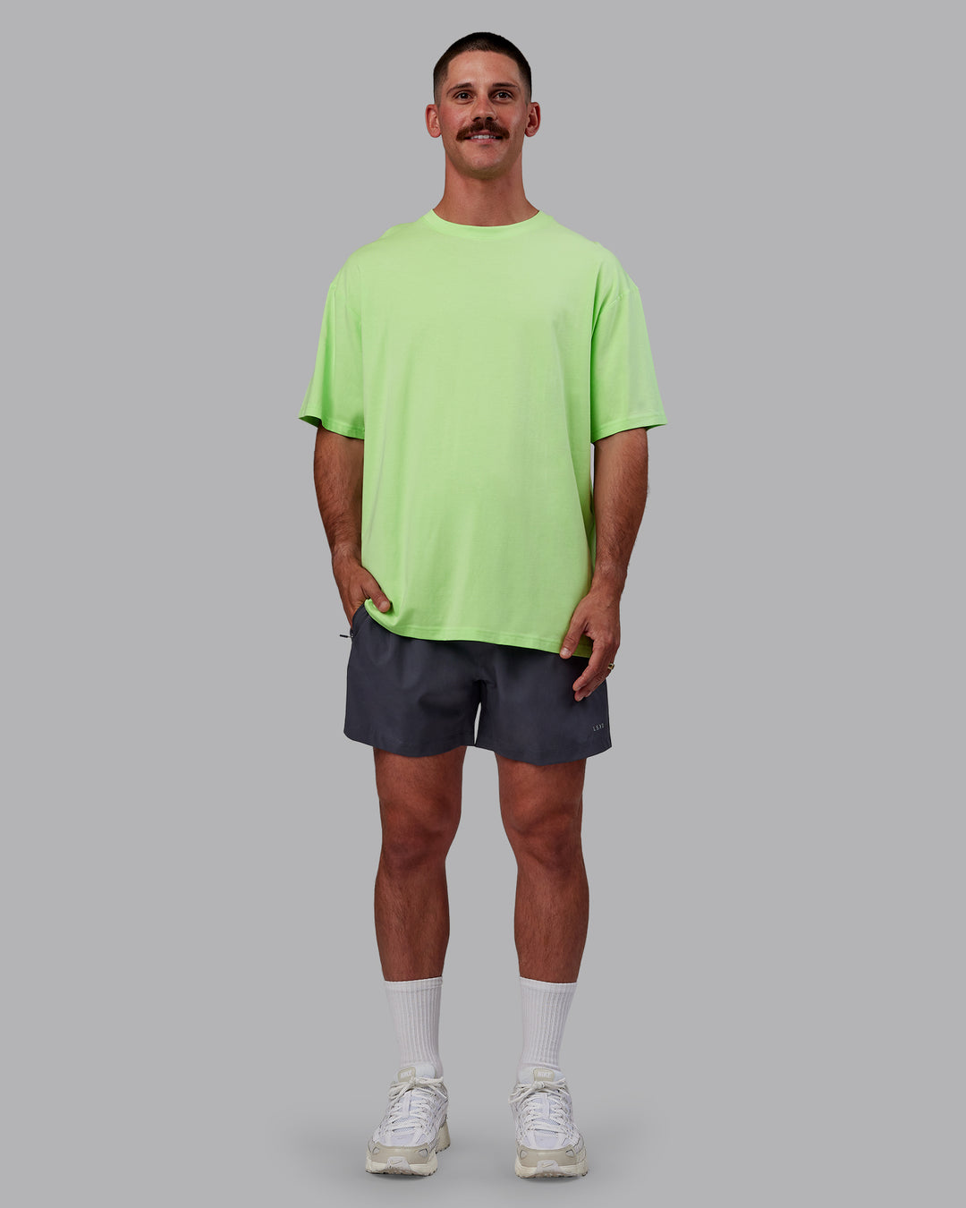 Man wearing Bree Masters Unisex Vision FLXCotton Tee Oversize - Pastel Lime-Stormy
