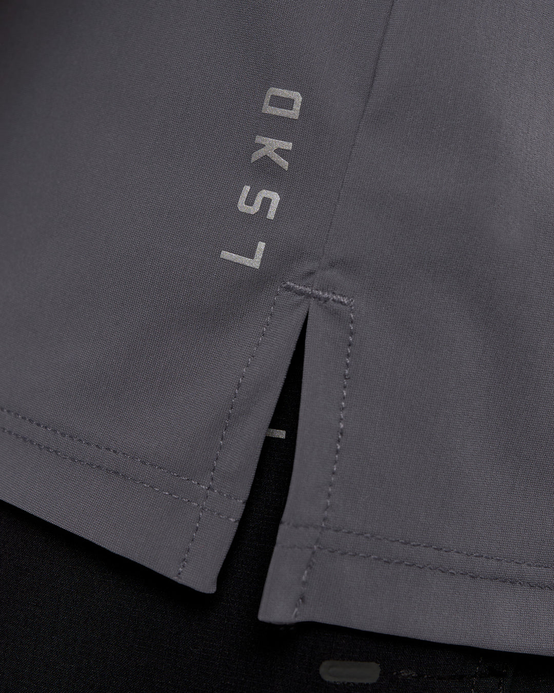 Man wearing Cadence MicroMotion Muscle Tank - Dark Storm | Model:Sam | Size:L