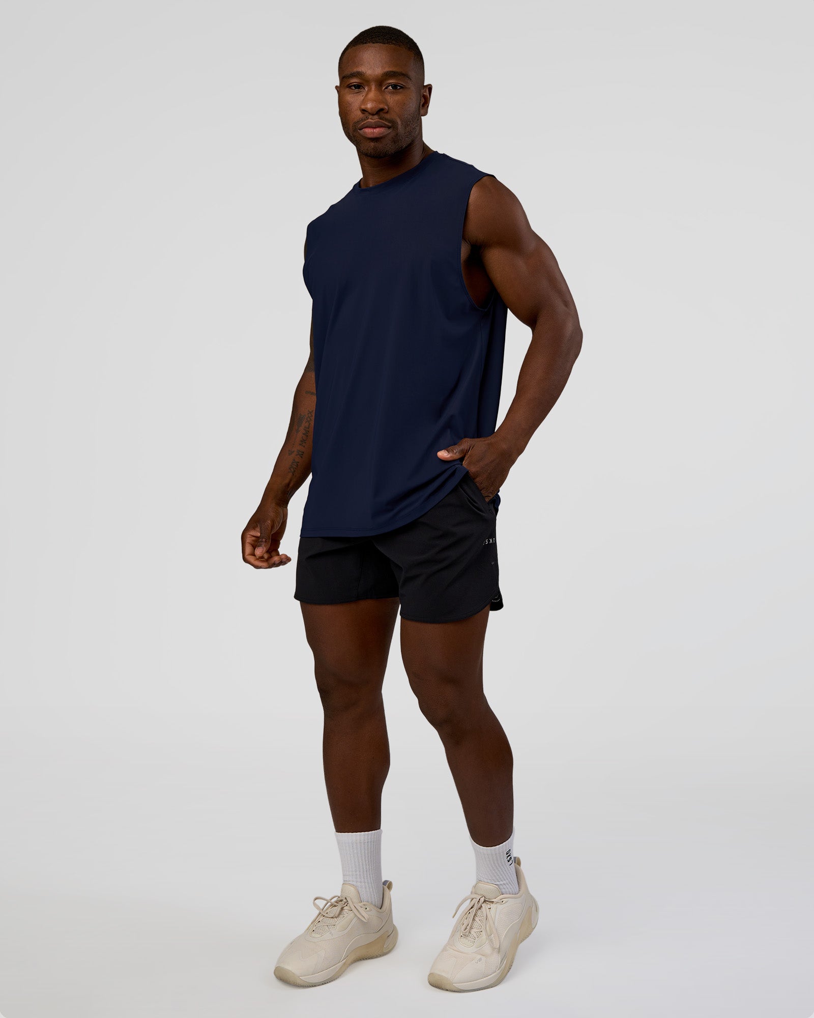 Man wearing Cadence MicroMotion Muscle Tank - Future Navy | Model:Sam | Size:L