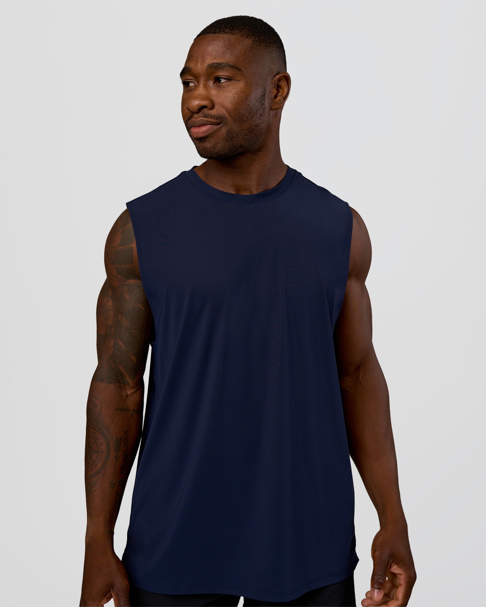 Man wearing Cadence MicroMotion Muscle Tank - Future Navy | Model:Sam | Size:L