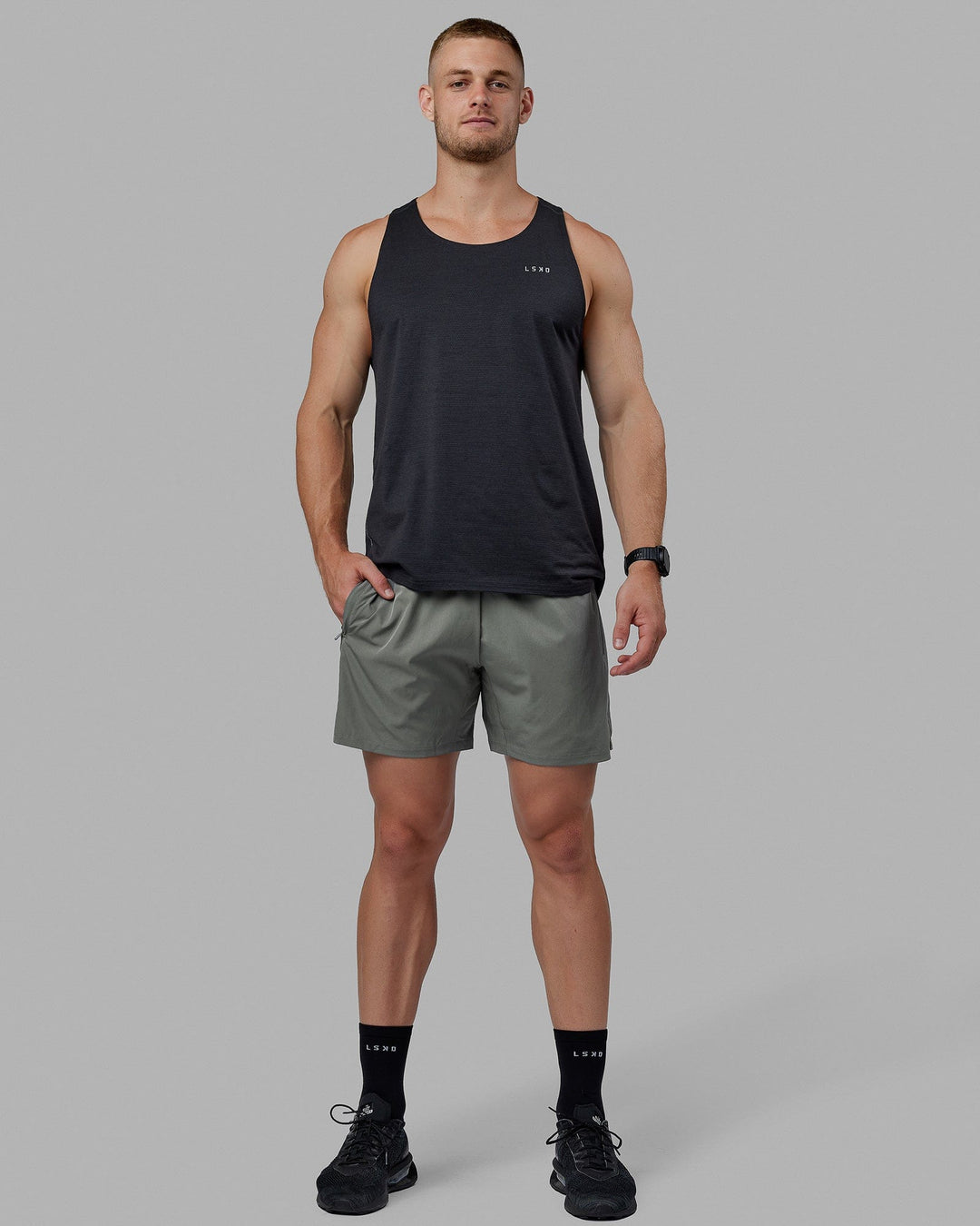 Man wearing Challenger 6&quot; Lined Performance Shorts - Graphite