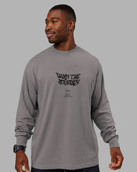 Man wearing Chrome Washed Heavyweight Oversized Long Sleeve Tee - Circular Grey-Black | Model:Sam | Size:L