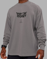 Man wearing Chrome Washed Heavyweight Oversized Long Sleeve Tee - Circular Grey-Black | Model:Sam | Size:L