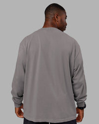 Man wearing Chrome Washed Heavyweight Oversized Long Sleeve Tee - Circular Grey-Black | Model:Sam | Size:L
