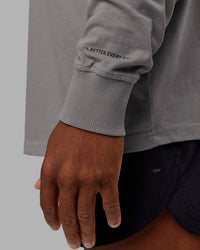 Man wearing Chrome Washed Heavyweight Oversized Long Sleeve Tee - Circular Grey-Black | Model:Sam | Size:L