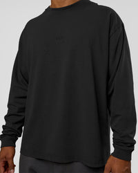 Man wearing Classic Heavyweight FLXCotton Oversized Long Sleeve Tee - Washed Black-Black | Model:Xav | Size:L