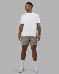 Man wearing Daily Pigment 5" Short - Pigment Slate | Model:Xav | Size:L