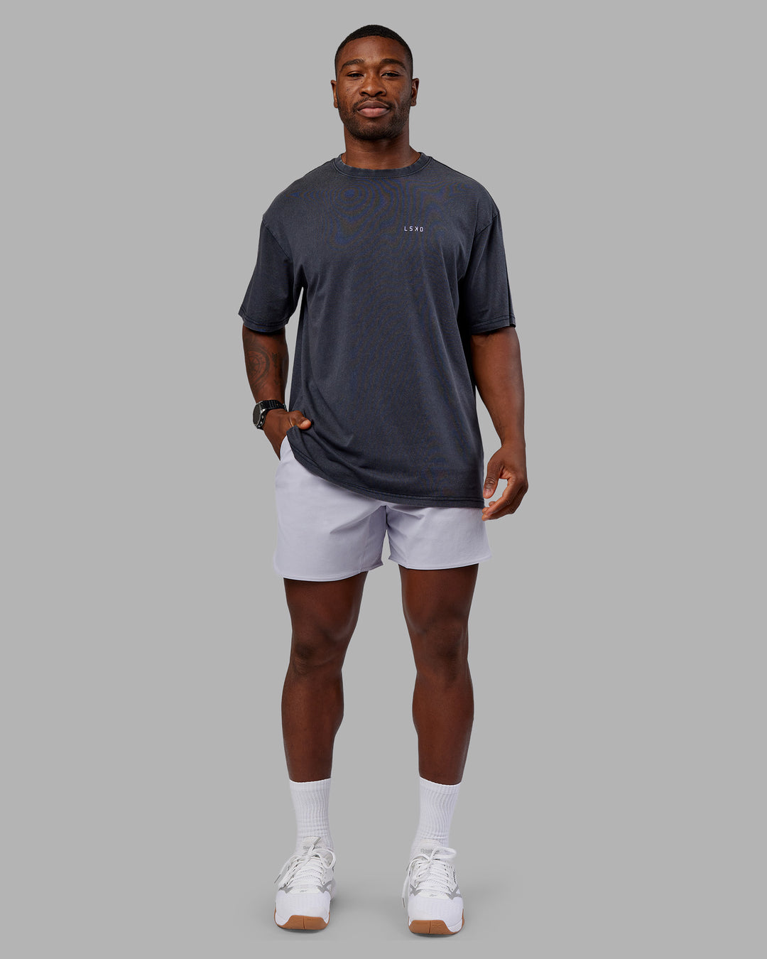 Man wearing Dare To Think FLXCotton Tee Oversize - Black Washed-Violet Ray | Model:Sam | Size:L