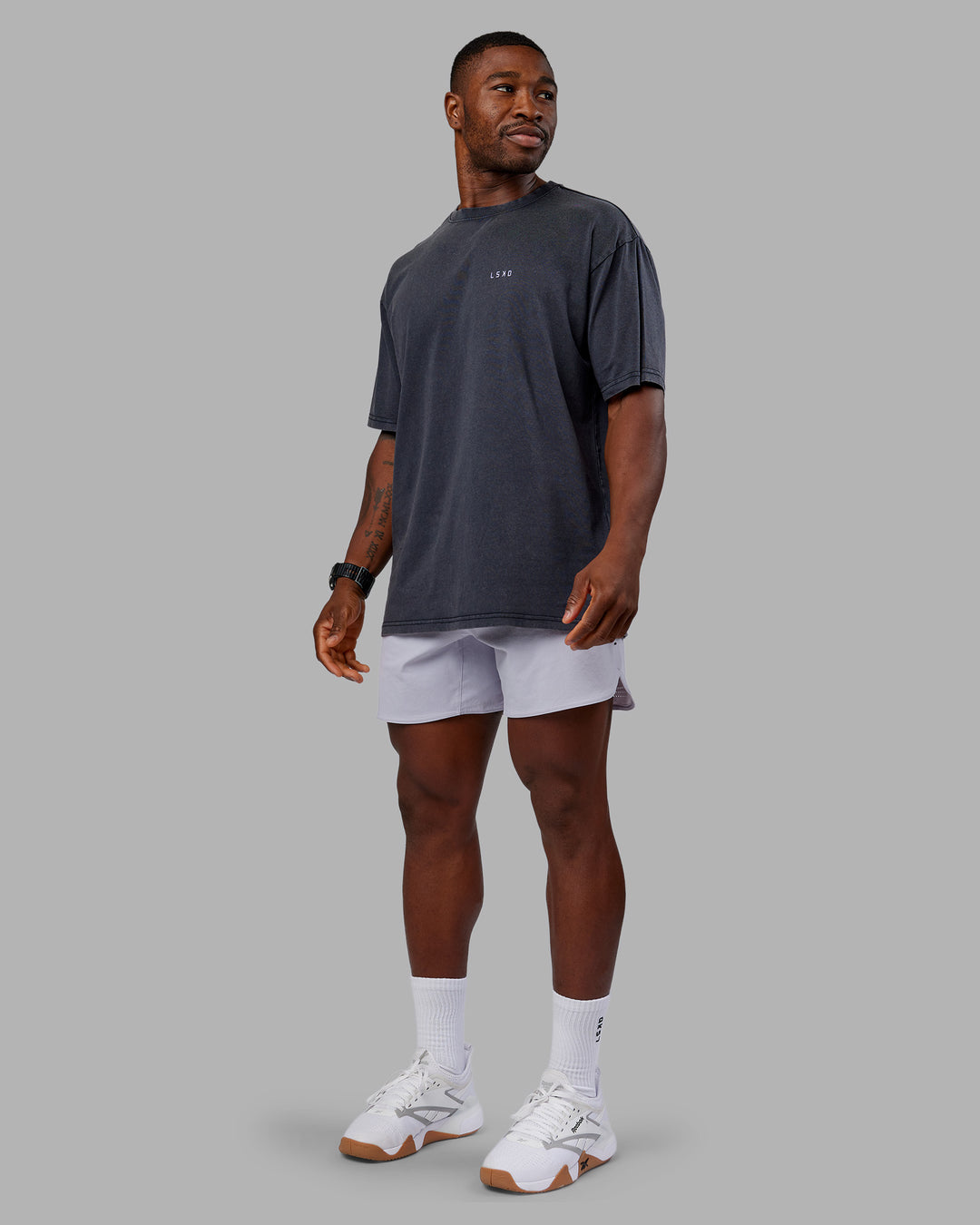 Man wearing Dare To Think FLXCotton Tee Oversize - Black Washed-Violet Ray | Model:Sam | Size:L