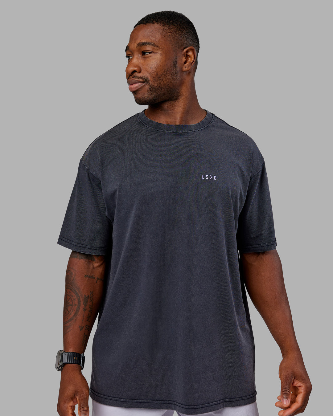 Man wearing Dare To Think FLXCotton Tee Oversize - Black Washed-Violet Ray | Model:Sam | Size:L