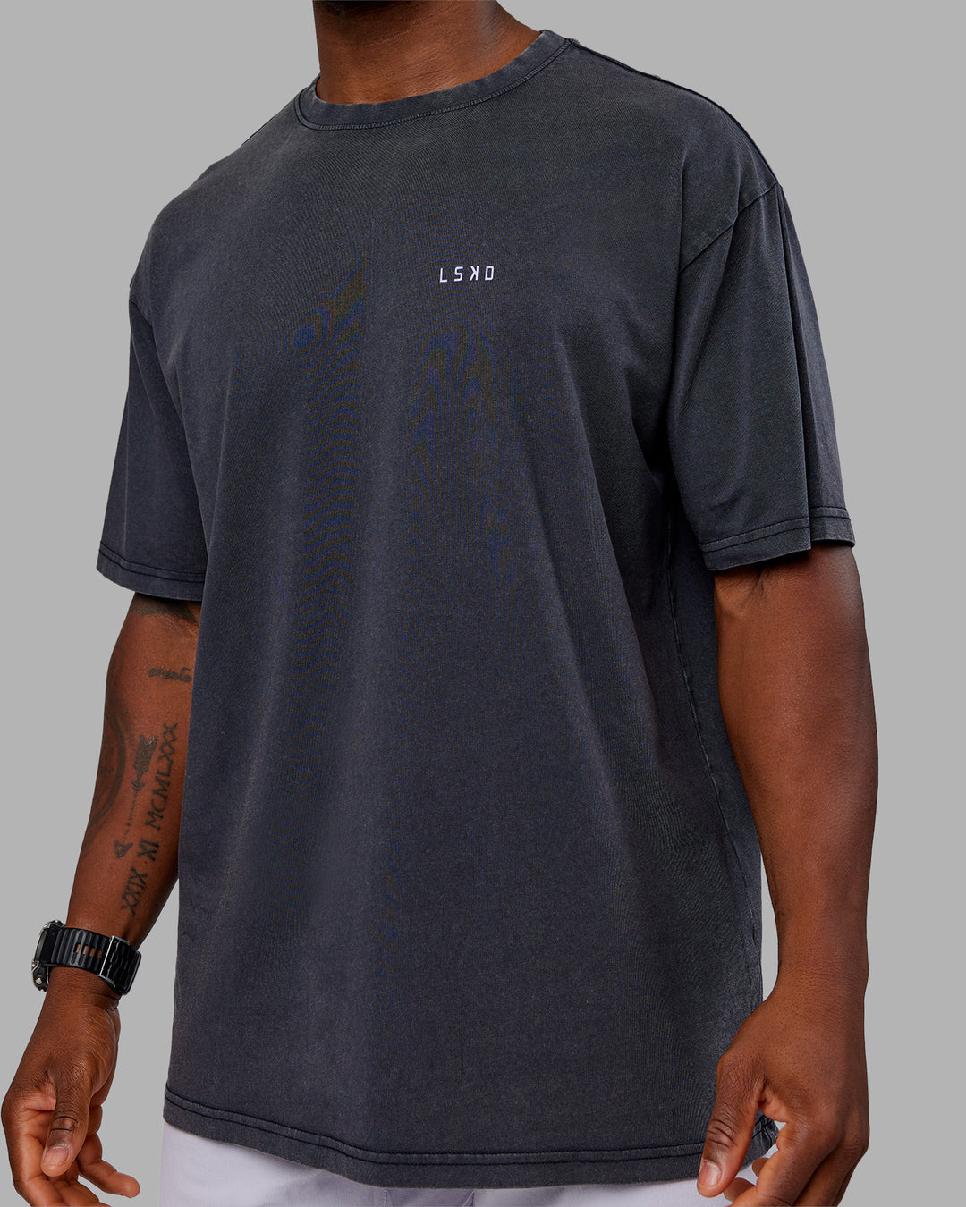 Man wearing Dare To Think FLXCotton Tee Oversize - Black Washed-Violet Ray | Model:Sam | Size:L