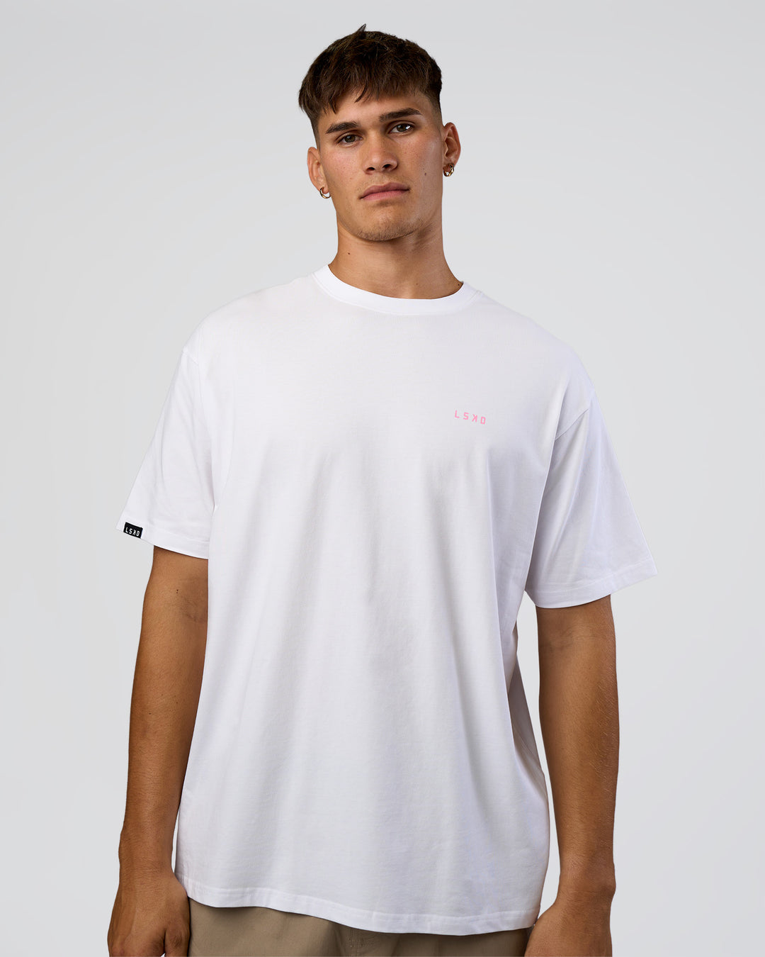 Man wearing Dare To Think FLXCotton Tee Oversize - White-Candy Pink | Model:Jackson | Size:L