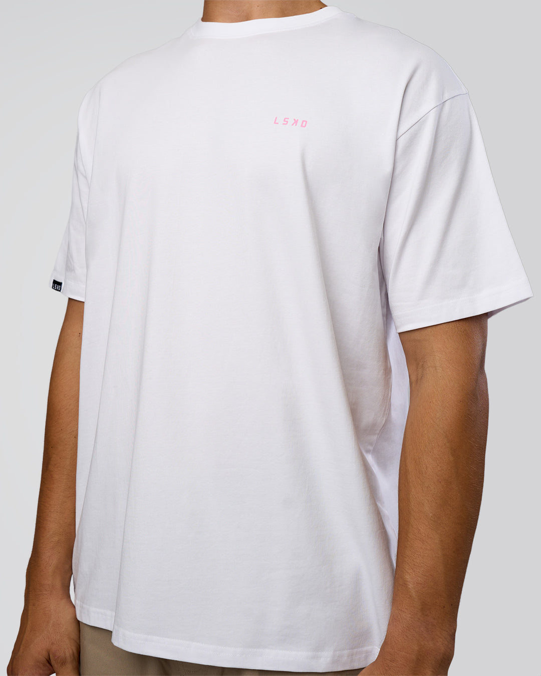 Man wearing Dare To Think FLXCotton Tee Oversize - White-Candy Pink | Model:Jackson | Size:L