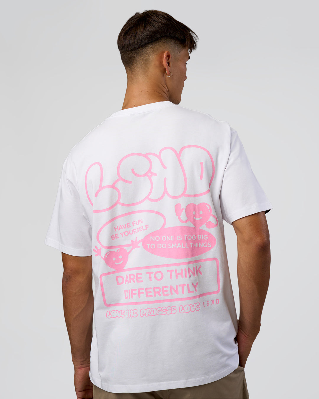 Man wearing Dare To Think FLXCotton Tee Oversize - White-Candy Pink | Model:Jackson | Size:L