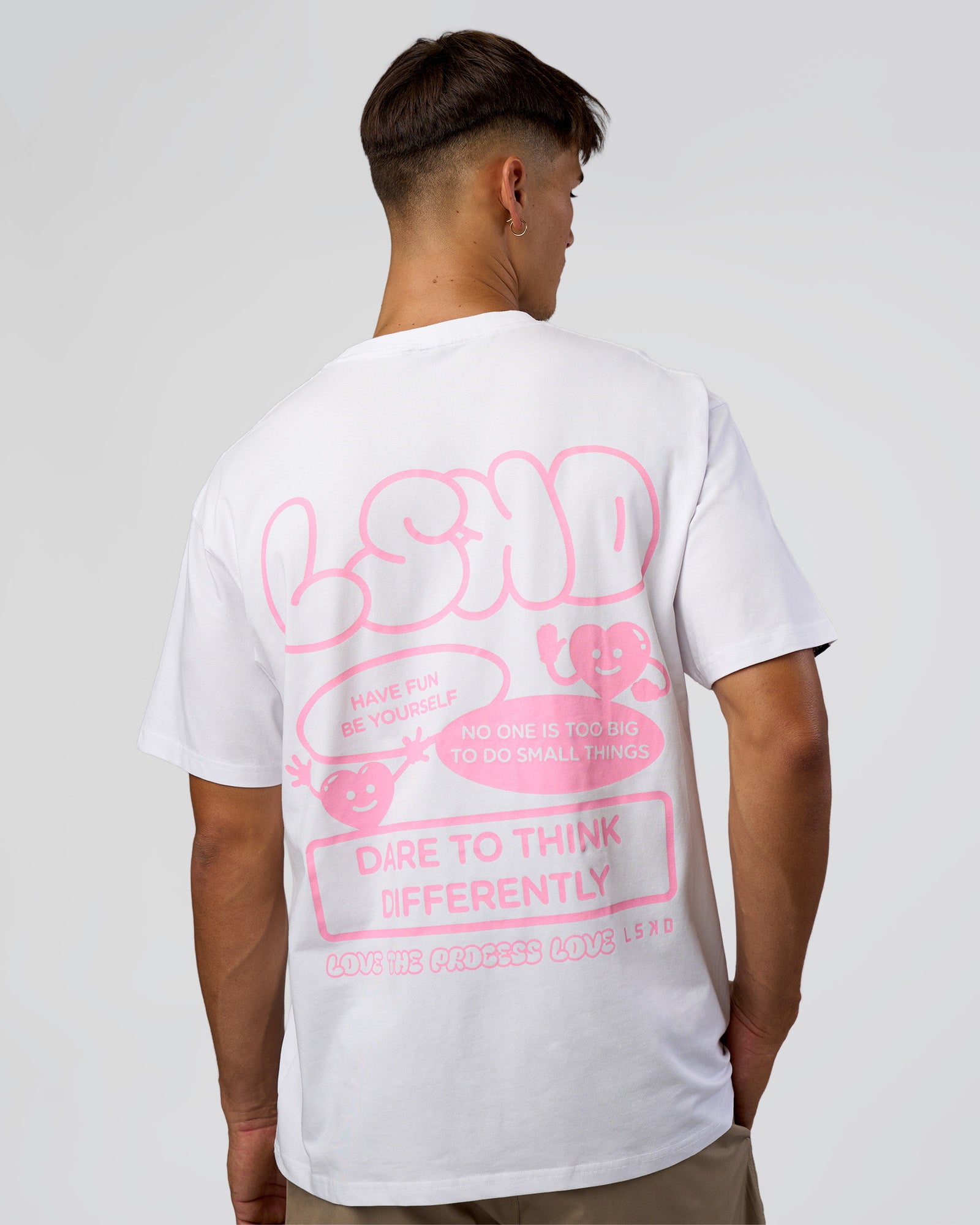 Man wearing Dare To Think FLXCotton Tee Oversize - White-Candy Pink | Model:Jackson | Size:L
