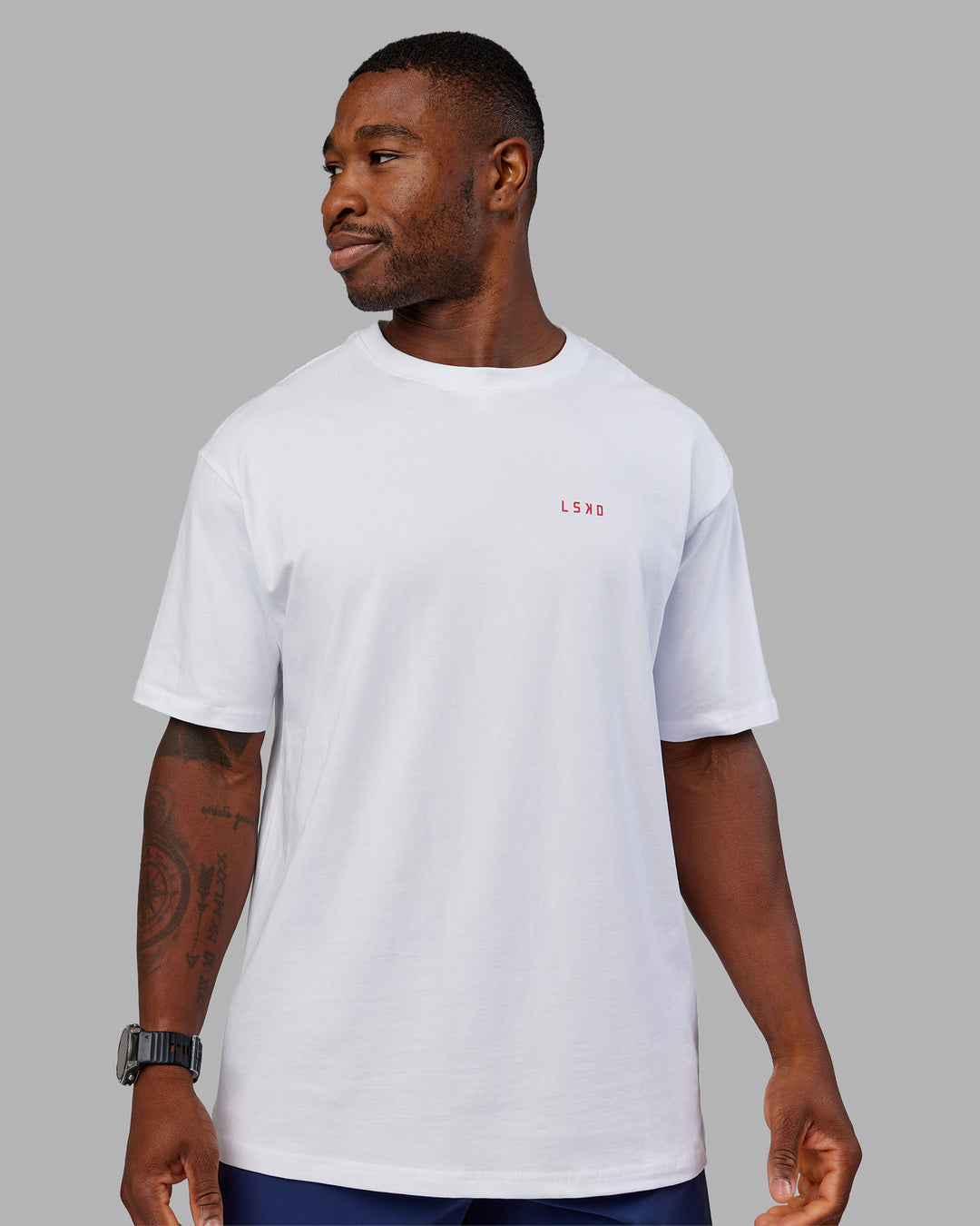 Man wearing Dare To Think FLXCotton Tee Oversize - White-Scarlet | Model:Sam | Size:L