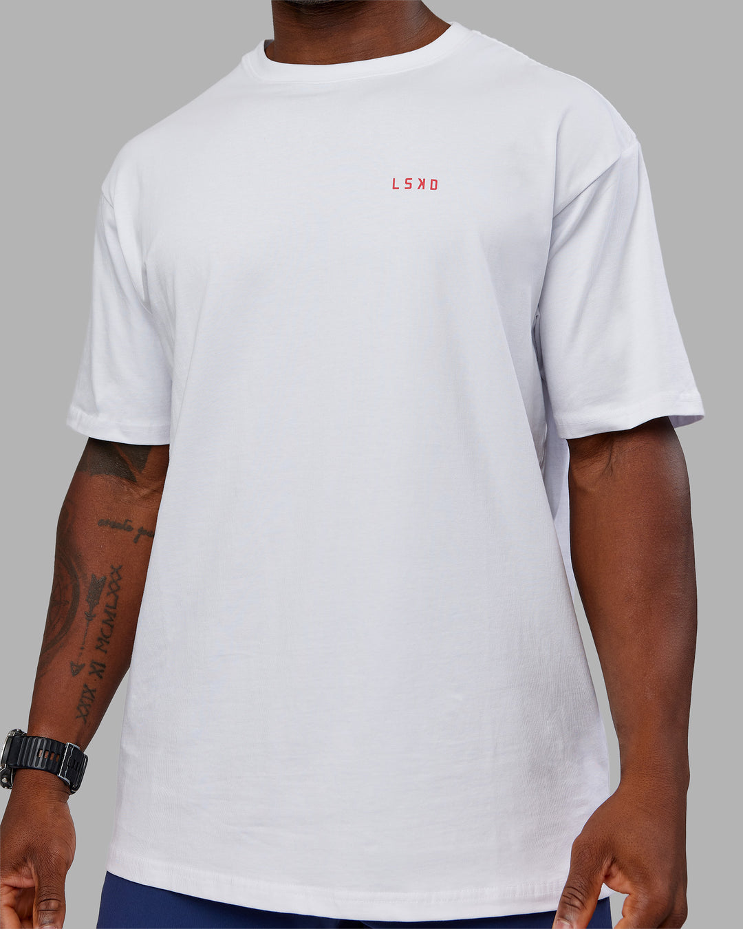 Man wearing Dare To Think FLXCotton Tee Oversize - White-Scarlet | Model:Sam | Size:L