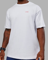 Man wearing Dare To Think FLXCotton Tee Oversize - White-Scarlet | Model:Sam | Size:L