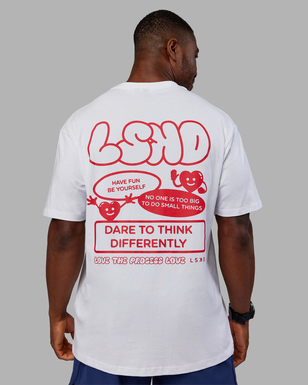 Man wearing Dare To Think FLXCotton Tee Oversize - White-Scarlet | Model:Sam | Size:L