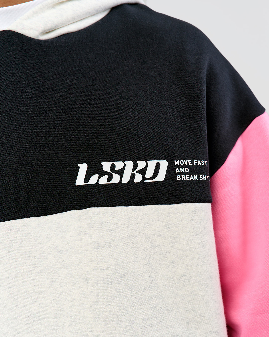 Man wearing Deconstructed Fleece Hoodie - Caviar-Candy Pink-Grey Marl | Model:Xav | Size:L