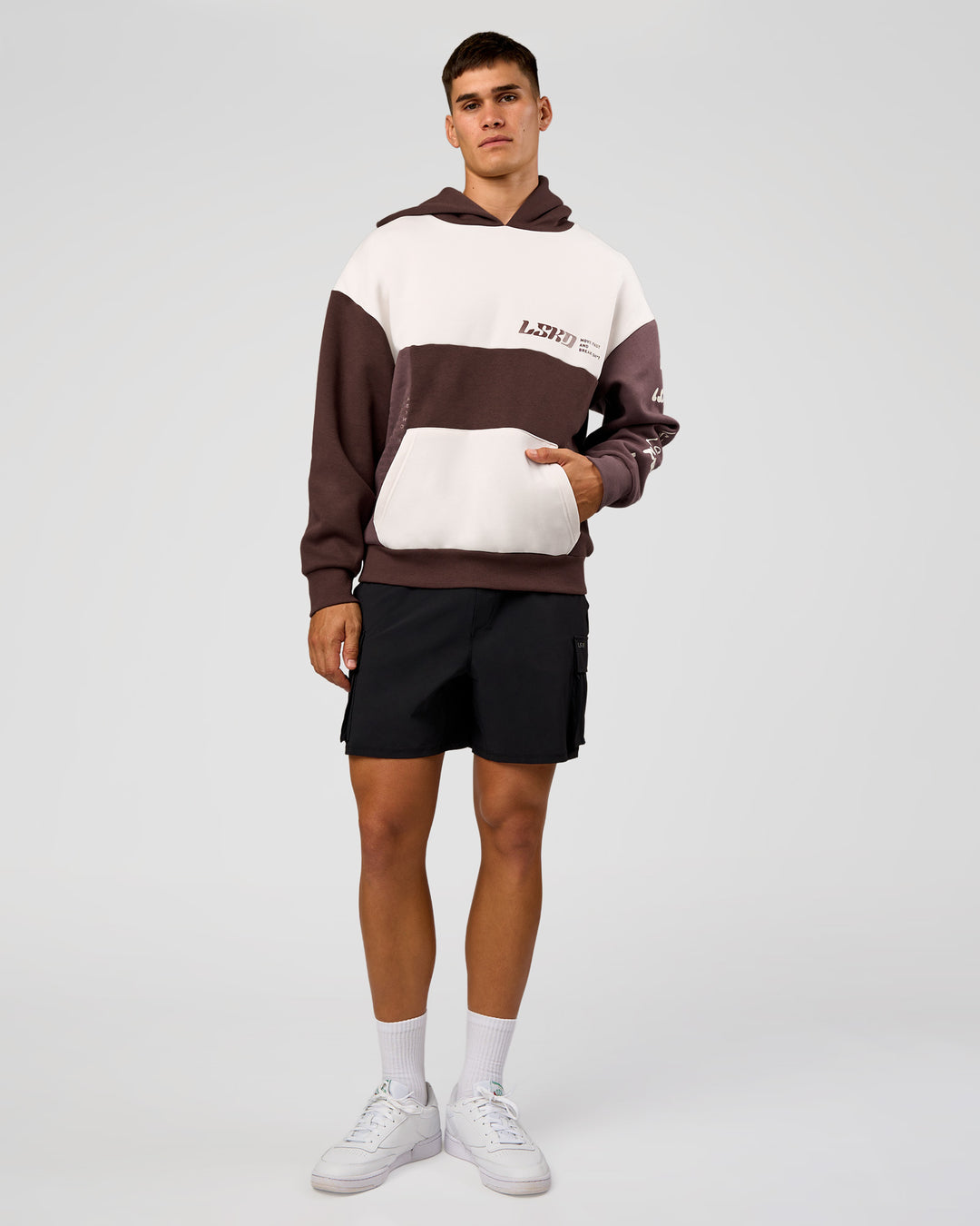 Man wearing Deconstructed Fleece Hoodie - Off White-Cocoa Powder-Choc | Model:Jackson | Size:L