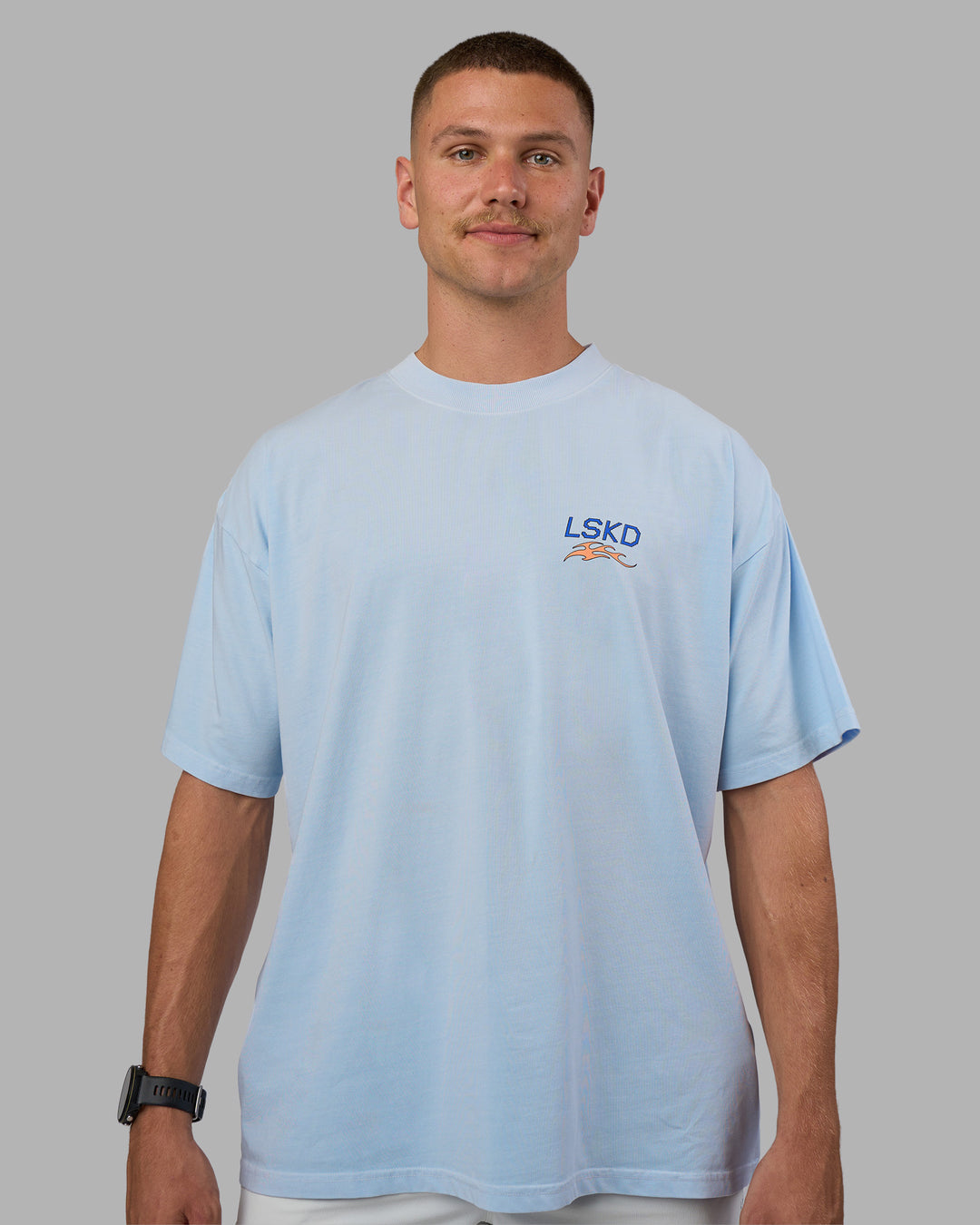Man wearing Digital World Heavyweight Oversized Tee - Open Air-Cantaloupe | Model:Nikola | Size:L