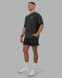 Man wearing Digital World Heavyweight Oversized Tee - Washed Black | Model:Nikola | Size:L