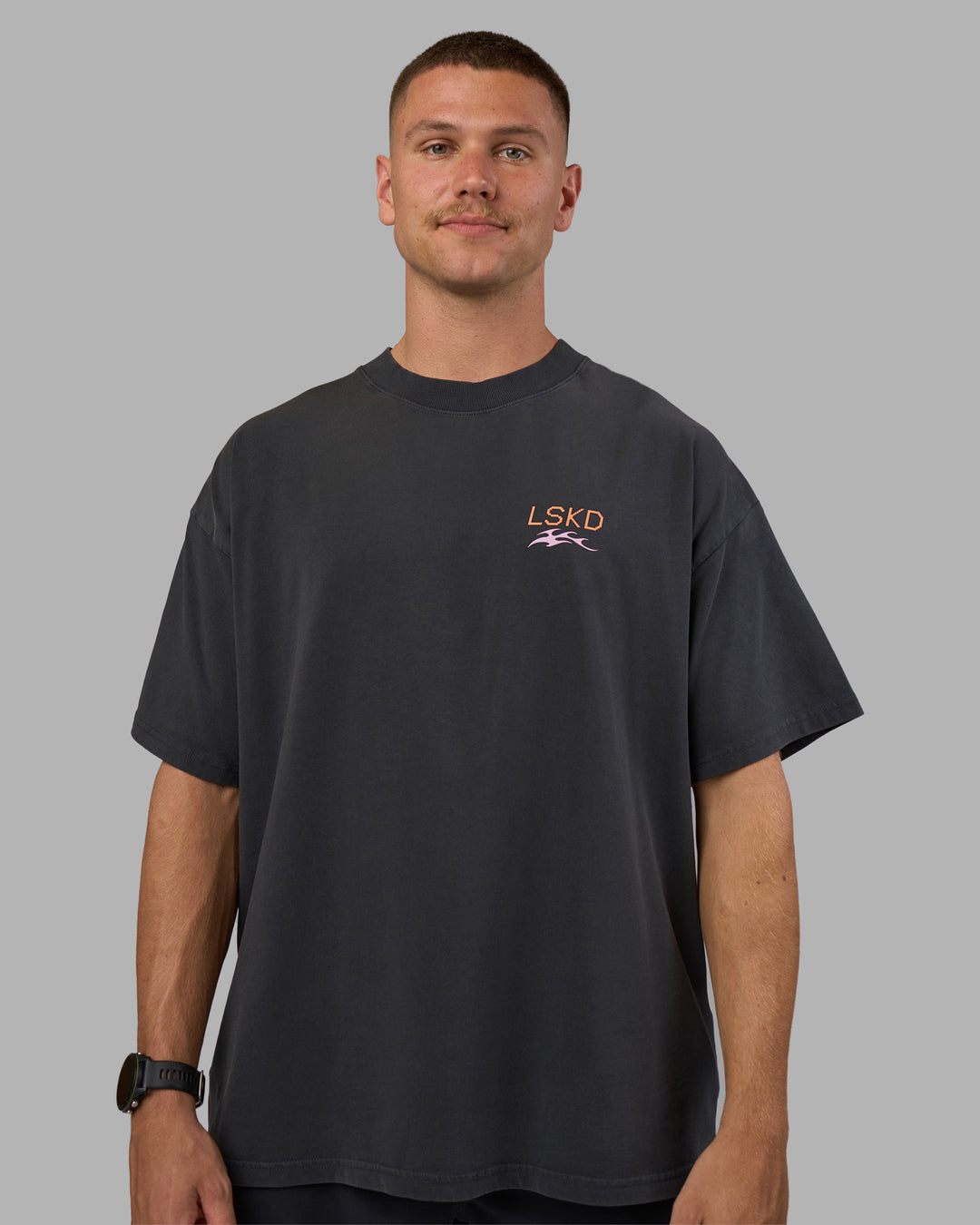 Man wearing Digital World Heavyweight Oversized Tee - Washed Black | Model:Nikola | Size:L