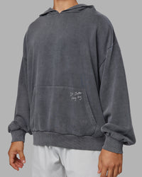 Man wearing ETJ Values Washed Unisex Oversize Hoodie - Dark Storm-Light Bubblegum | Model:Jackson | Size:L