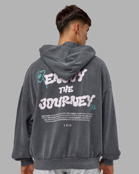 Man wearing ETJ Values Washed Unisex Oversize Hoodie - Dark Storm-Light Bubblegum | Model:Jackson | Size:L