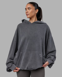 Woman wearing ETJ Values Washed Unisex Oversize Hoodie - Dark Storm-Light Bubblegum | Model:Rhiley | Size:L