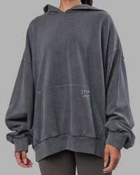 Woman wearing ETJ Values Washed Unisex Oversize Hoodie - Dark Storm-Light Bubblegum | Model:Rhiley | Size:L