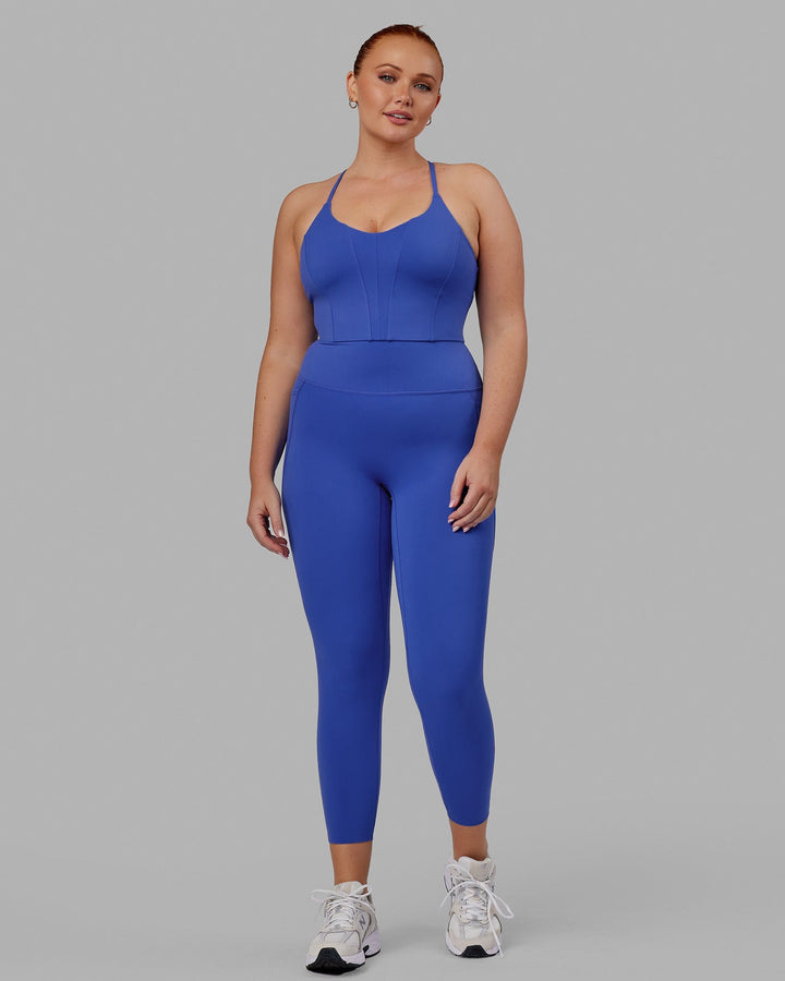 Woman wearing Elixir 7/8 Tights With Pockets - Power Cobalt