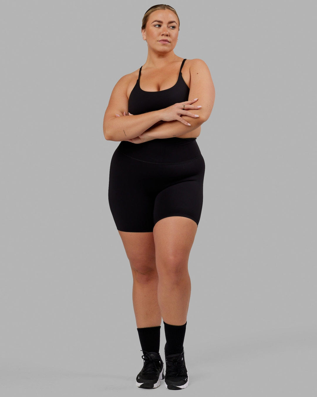Woman wearing Elixir Mid Short Tight - Black No Logo